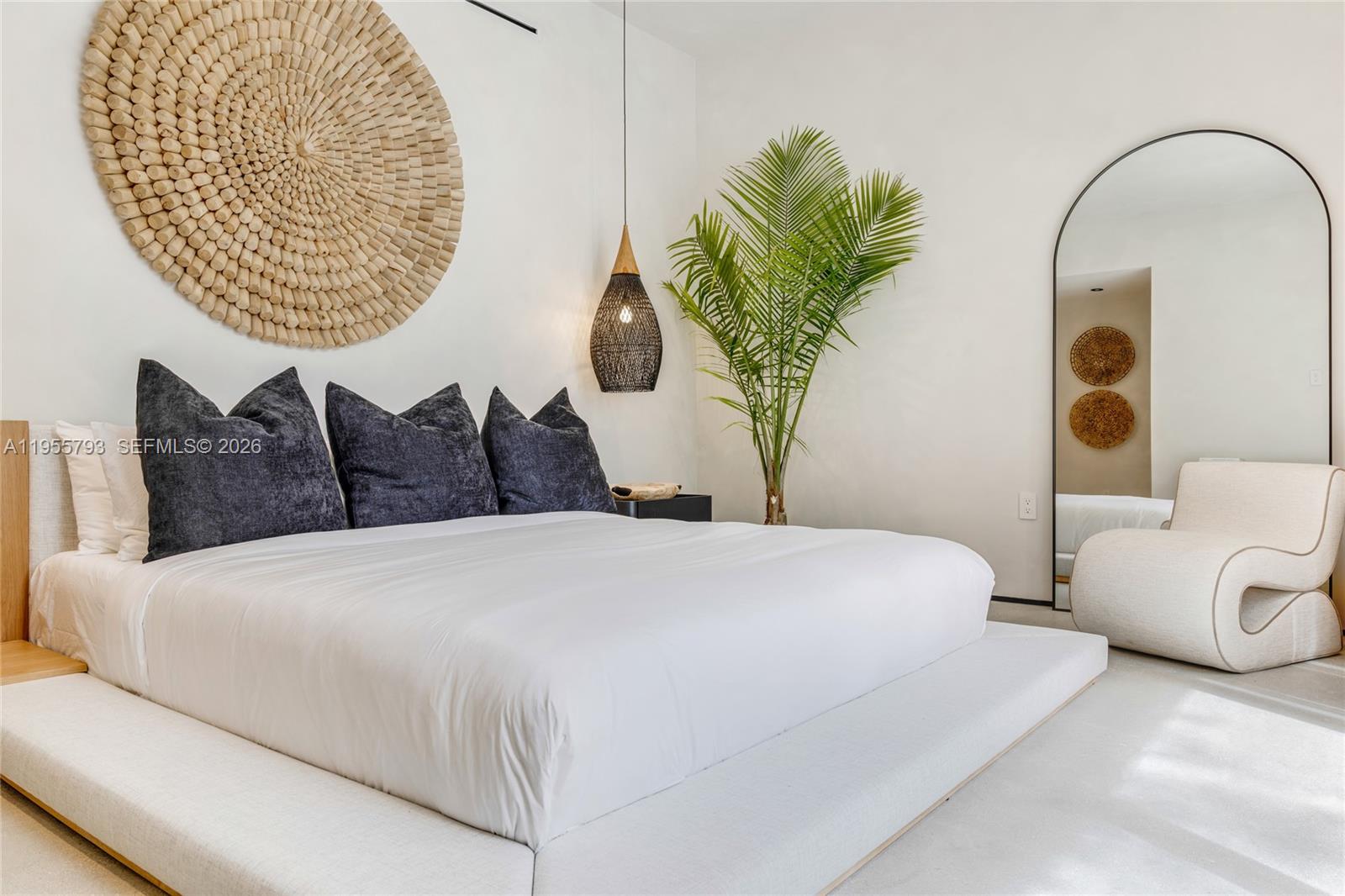 1000 Northwest 9th Court Miami, FL 33136 - Photo 31 of 43 a bedroom with a bed and a potted plant