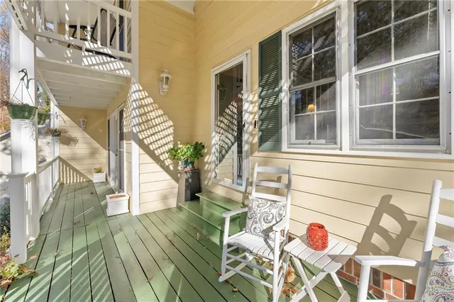 a view of entryway with wooden floor and fence