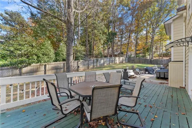 a view of a chairs and table on the deck
