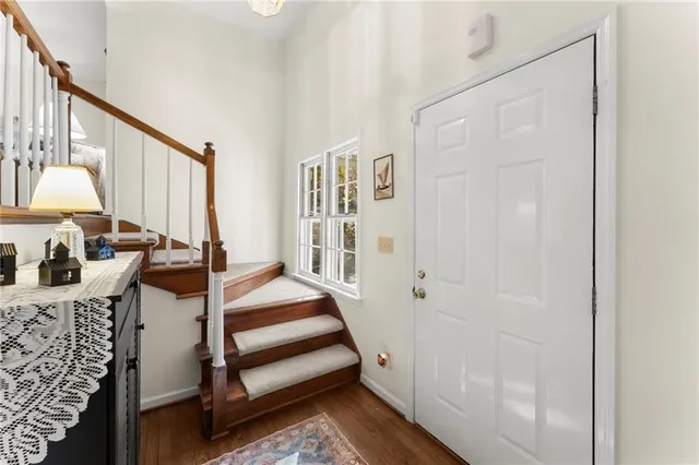 a bedroom with two beds and a window
