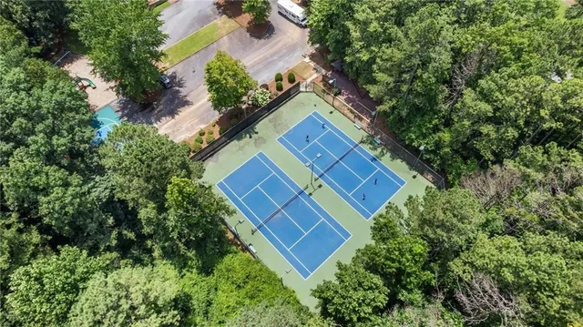 an aerial view of a house with a yard and garden