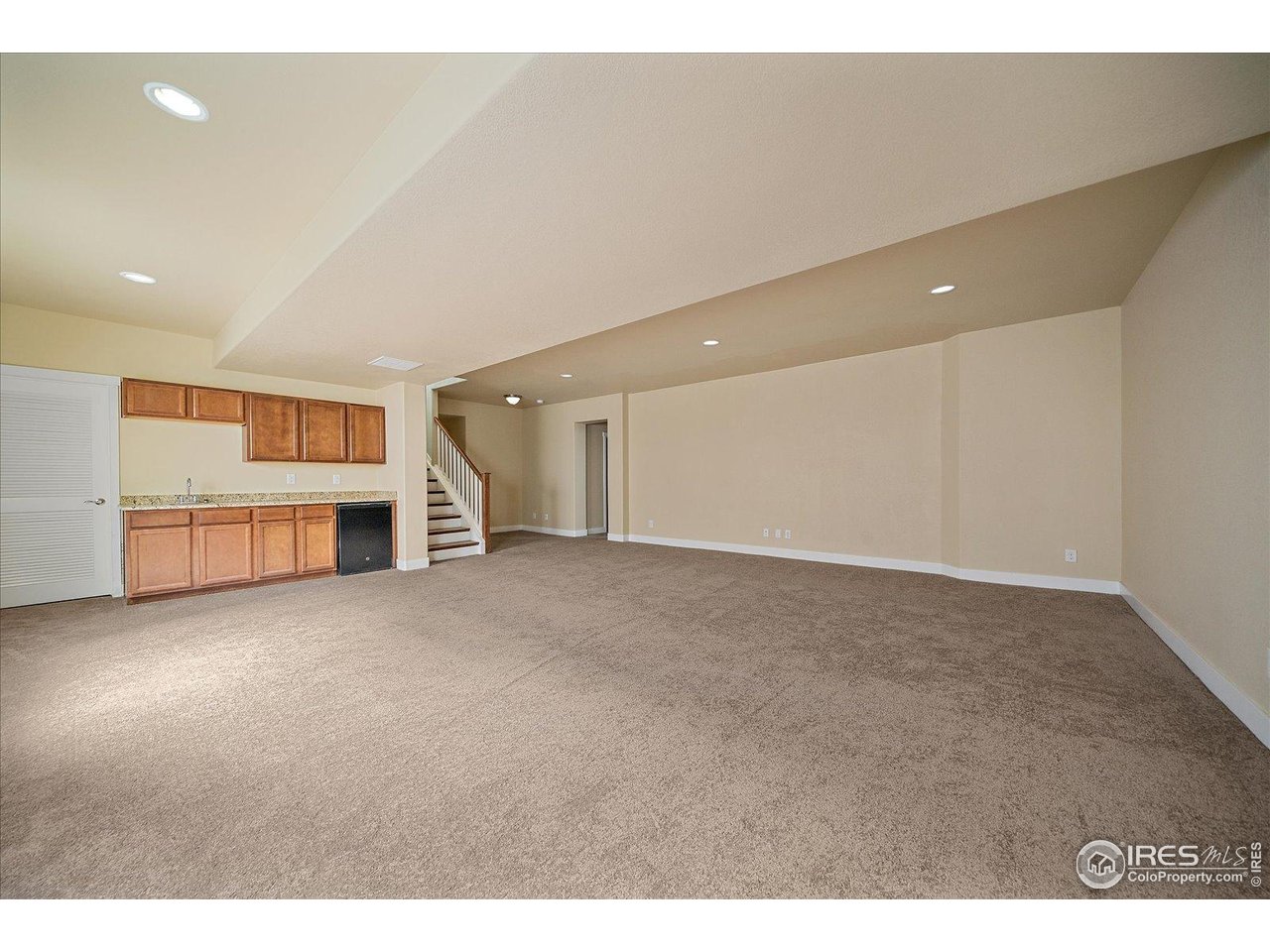 2321 Nicholson Street Berthoud, CO 80513 - Photo 17 of 22 a view of an empty room with a kitchen
