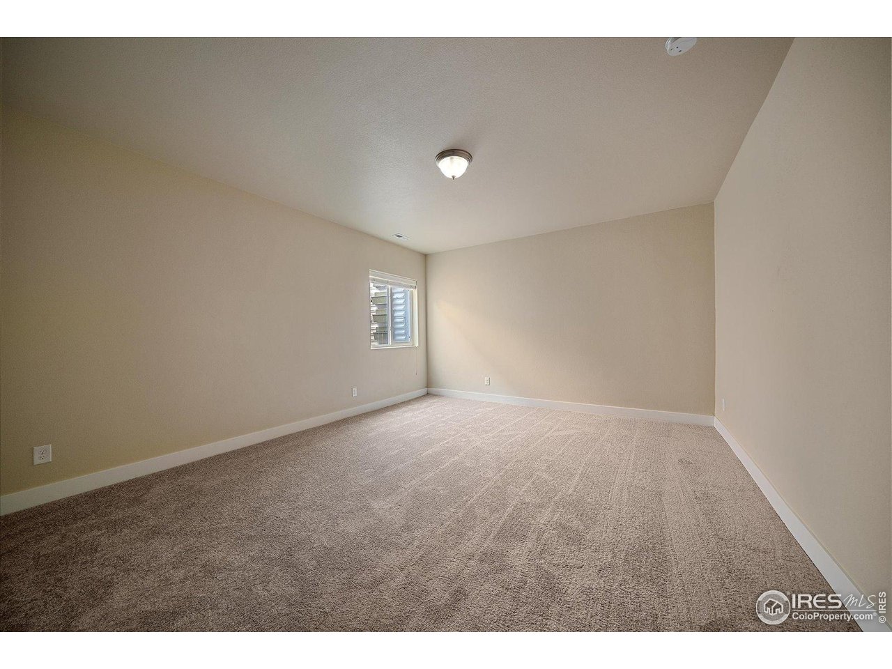 2321 Nicholson Street Berthoud, CO 80513 - Photo 18 of 22 a view of an empty room with a window