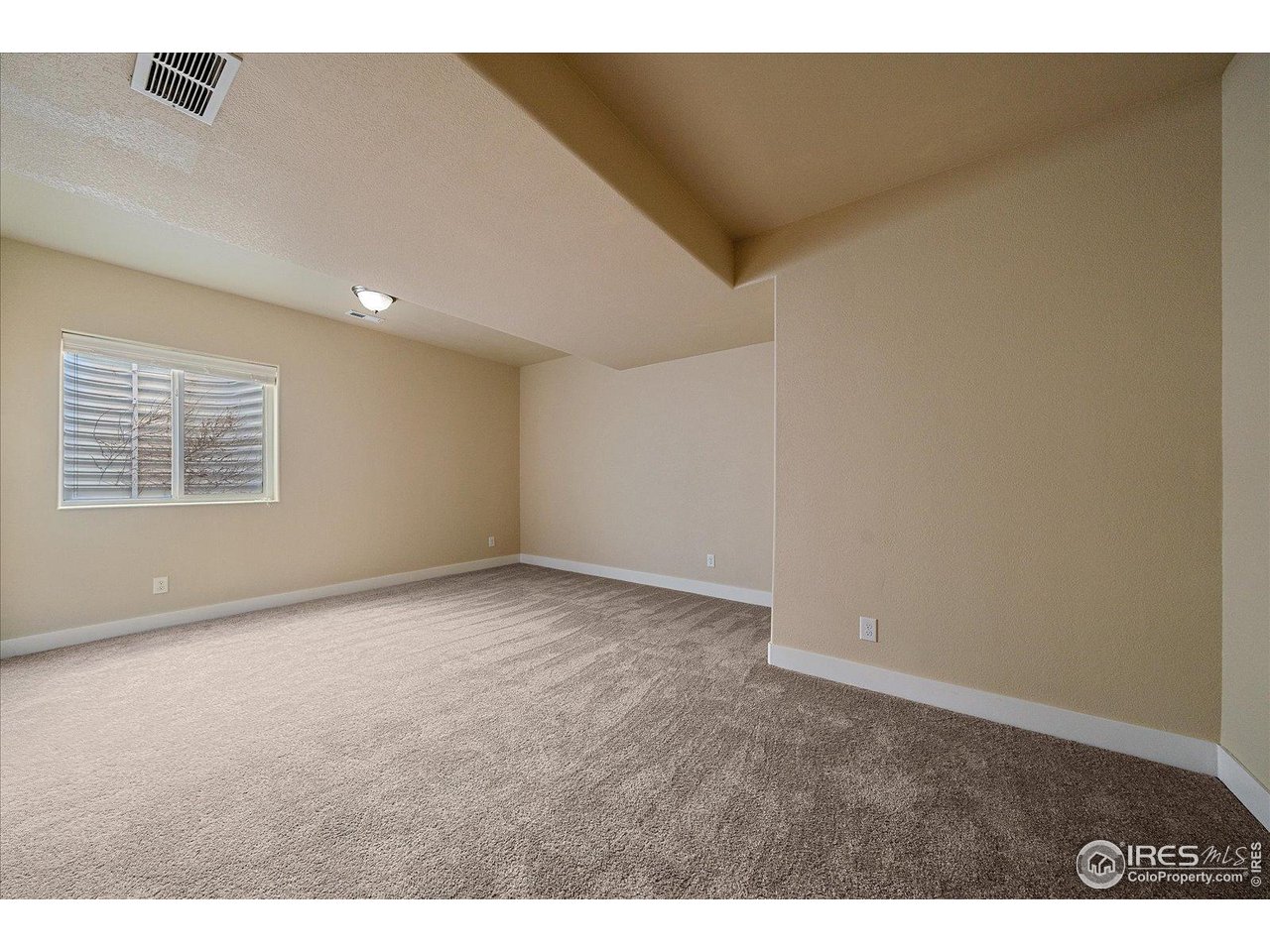2321 Nicholson Street Berthoud, CO 80513 - Photo 20 of 22 a view of an empty room with a window