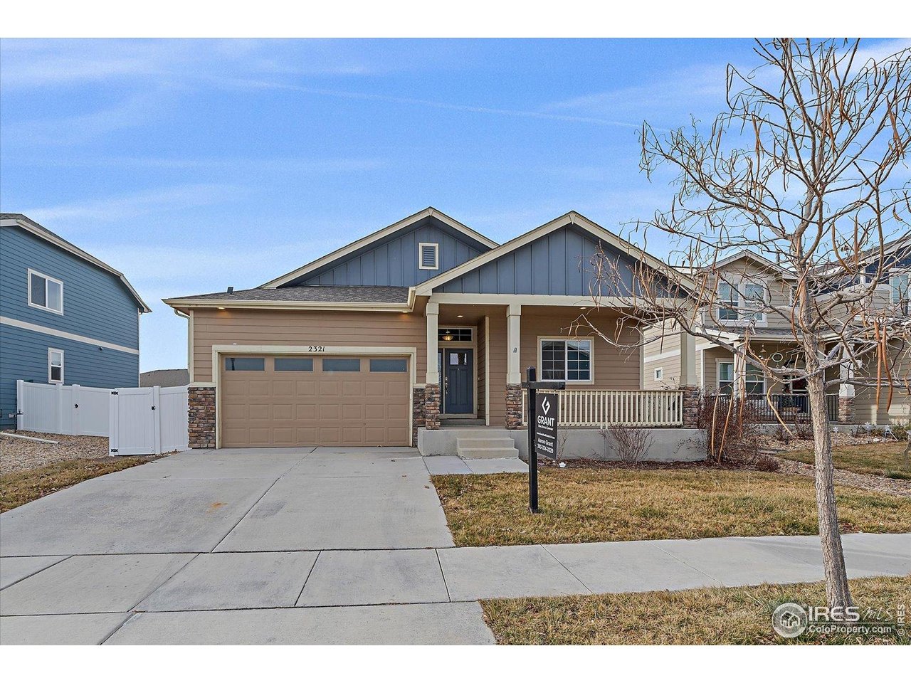 2321 Nicholson Street Berthoud, CO 80513 - Photo 2 of 22 a front view of a house with a yard and garage