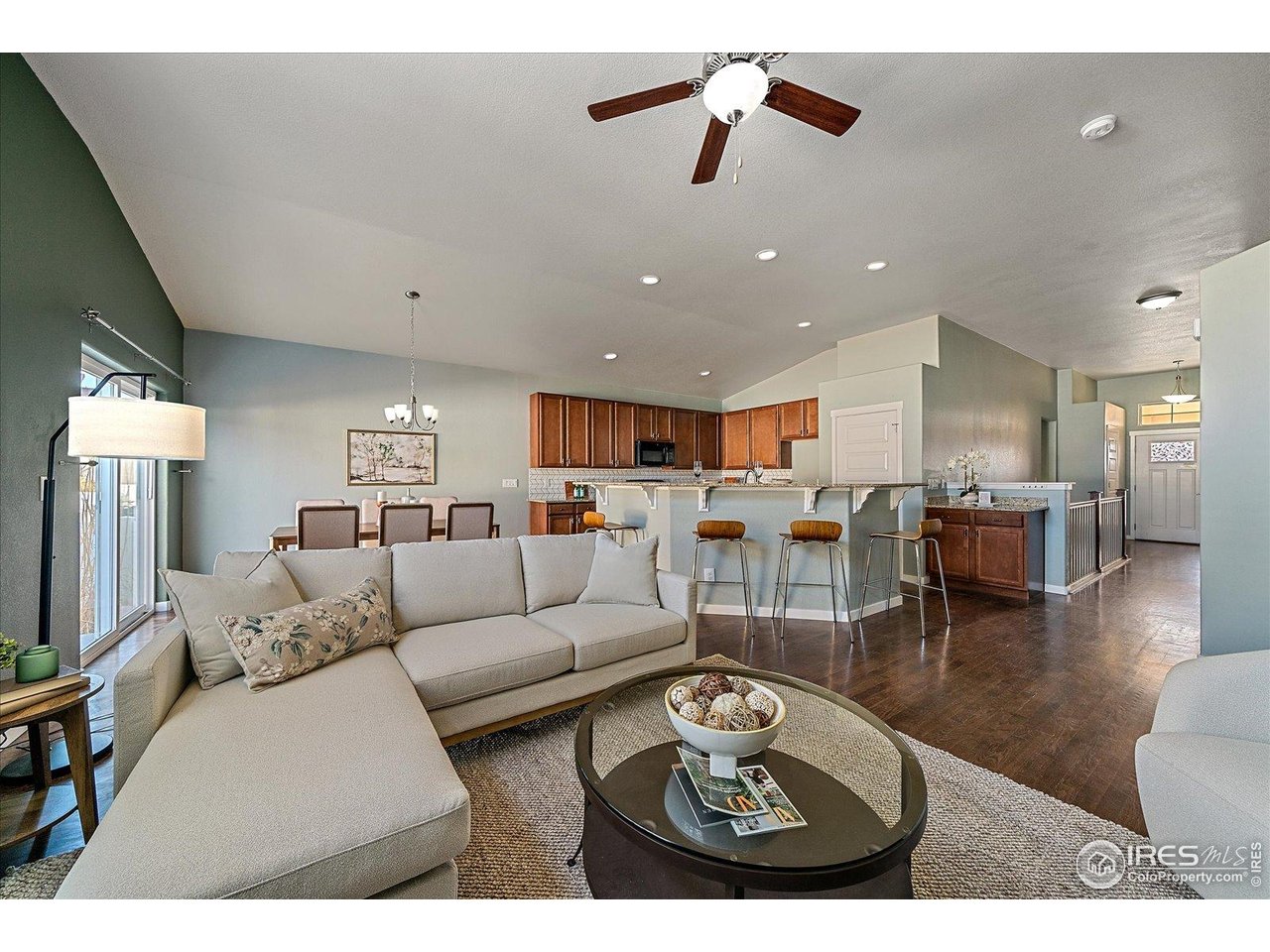 2321 Nicholson Street Berthoud, CO 80513 - Photo 5 of 22 a living room with furniture kitchen view and a chandelier
