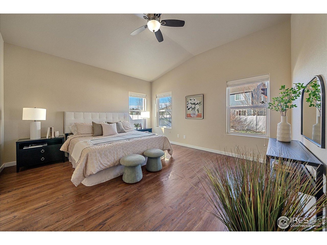 2321 Nicholson Street Berthoud, CO 80513 - Photo 10 of 22 a bedroom with a bed and wooden floor