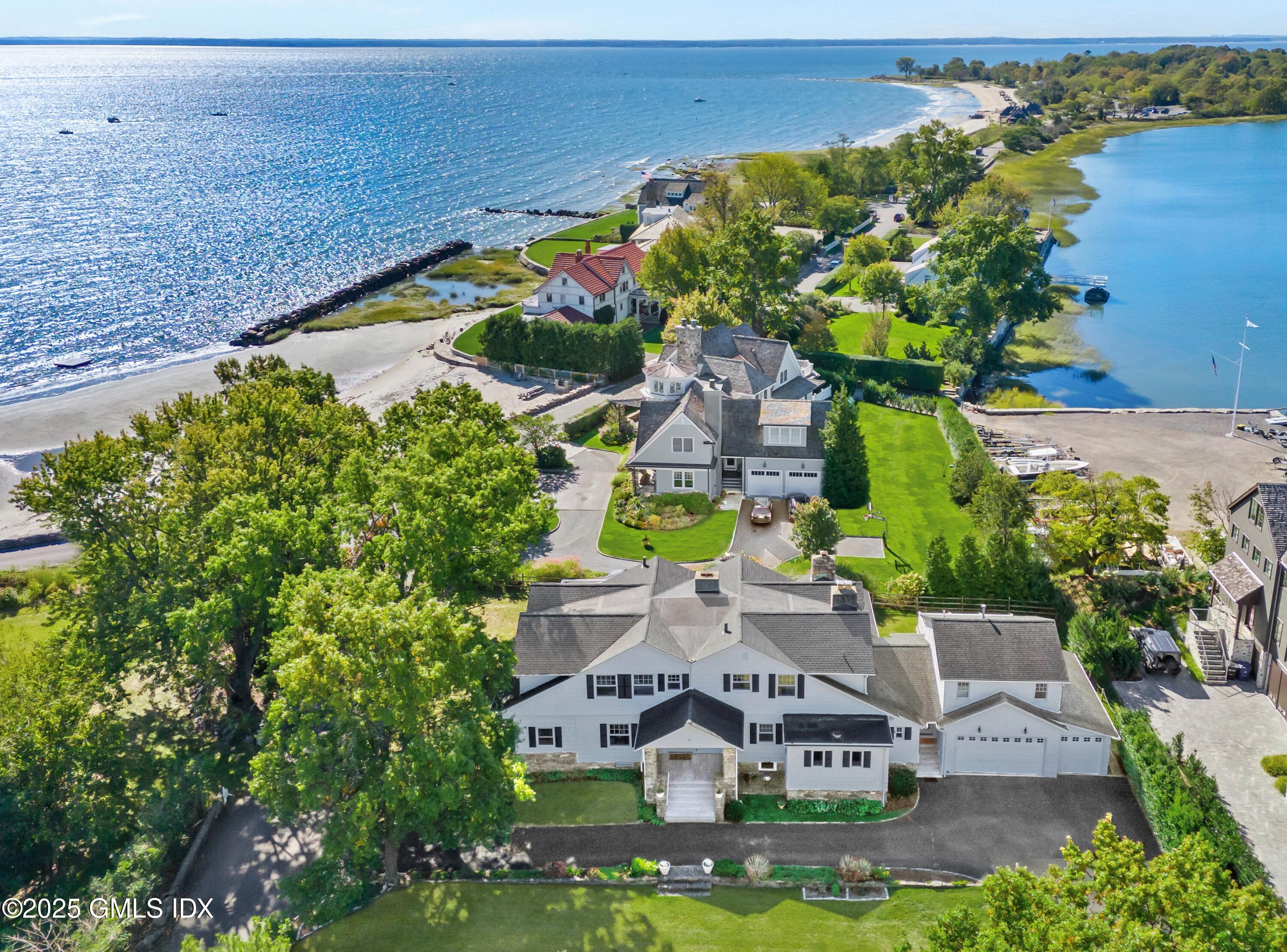 an aerial view of house with yard swimming pool and outdoor seating