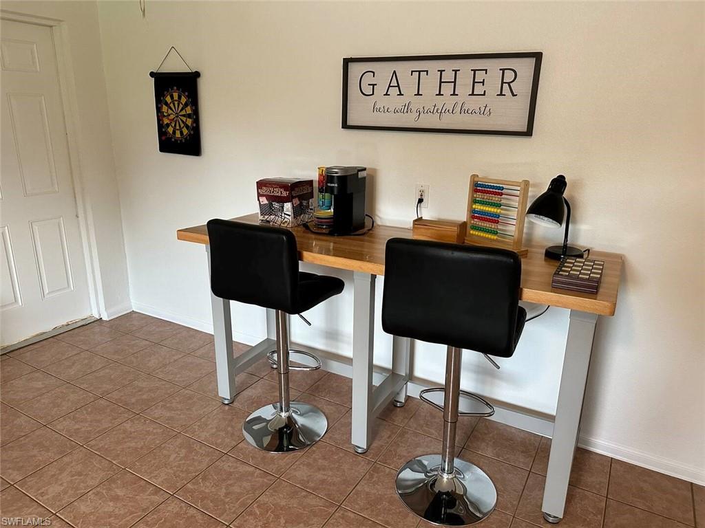 3440 15th Avenue Southwest Naples, FL 34117 - Photo 24 of 31 Dining area featuring tile patterned flooring