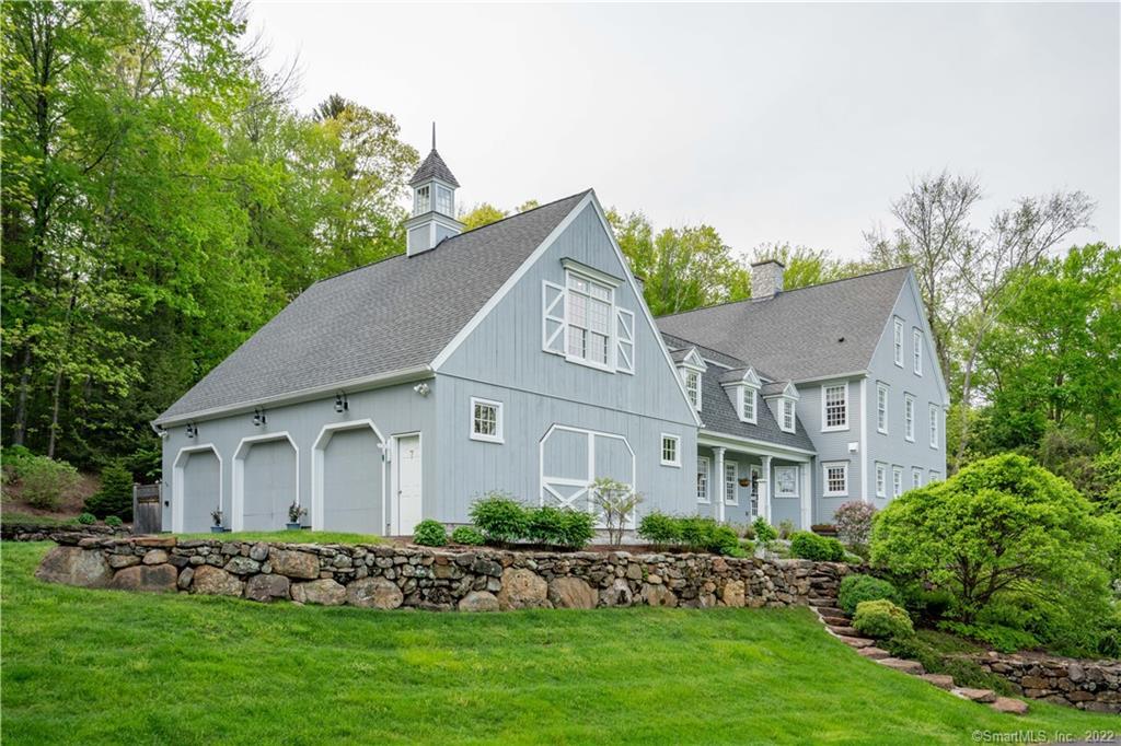 7 Up The Road Canton, CT 06019 - Photo 1 of 1 a front view of a house with a garden
