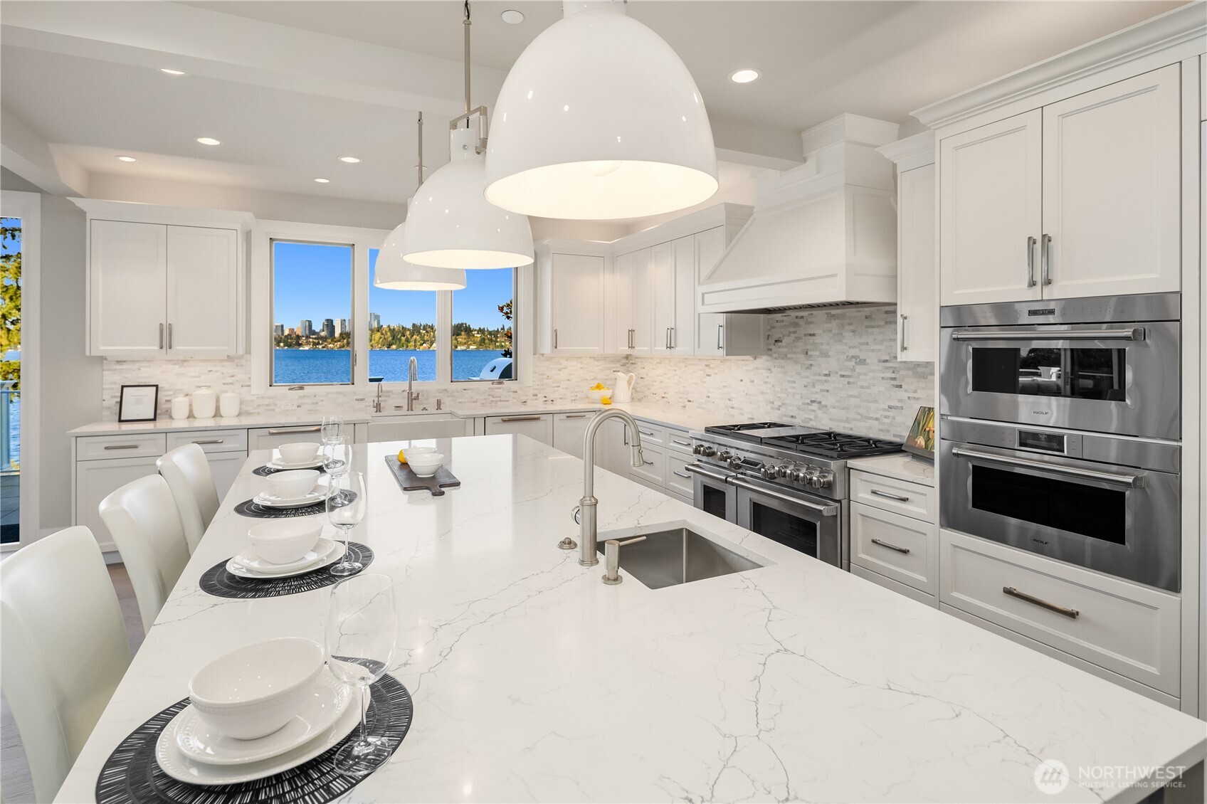 7254 North Mercer Way Mercer Island, WA 98040 - Photo 11 of 37 a kitchen with stainless steel appliances kitchen island granite countertop a sink and a stove