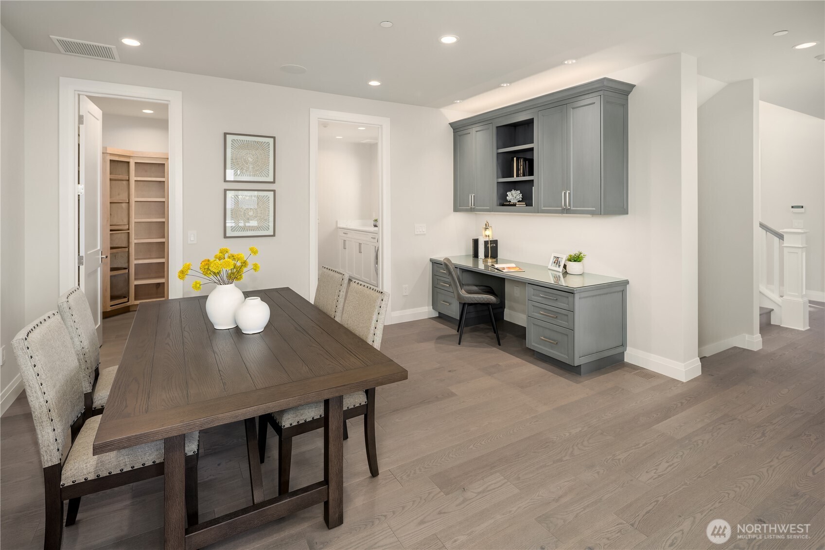 7254 North Mercer Way Mercer Island, WA 98040 - Photo 12 of 37 a view of a dining room with furniture and a flat screen tv