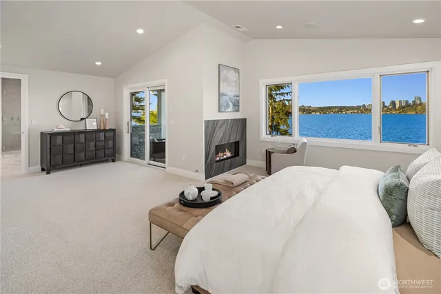 a bedroom with a bed window and dresser