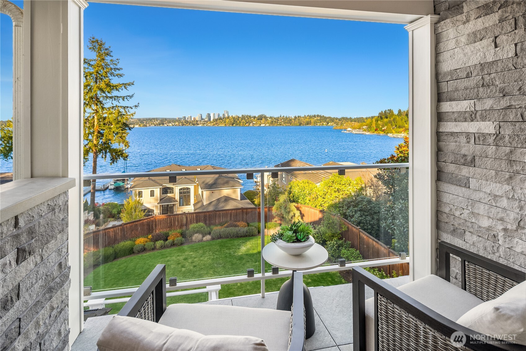 7254 North Mercer Way Mercer Island, WA 98040 - Photo 22 of 37 a view of a chairs and table in the balcony