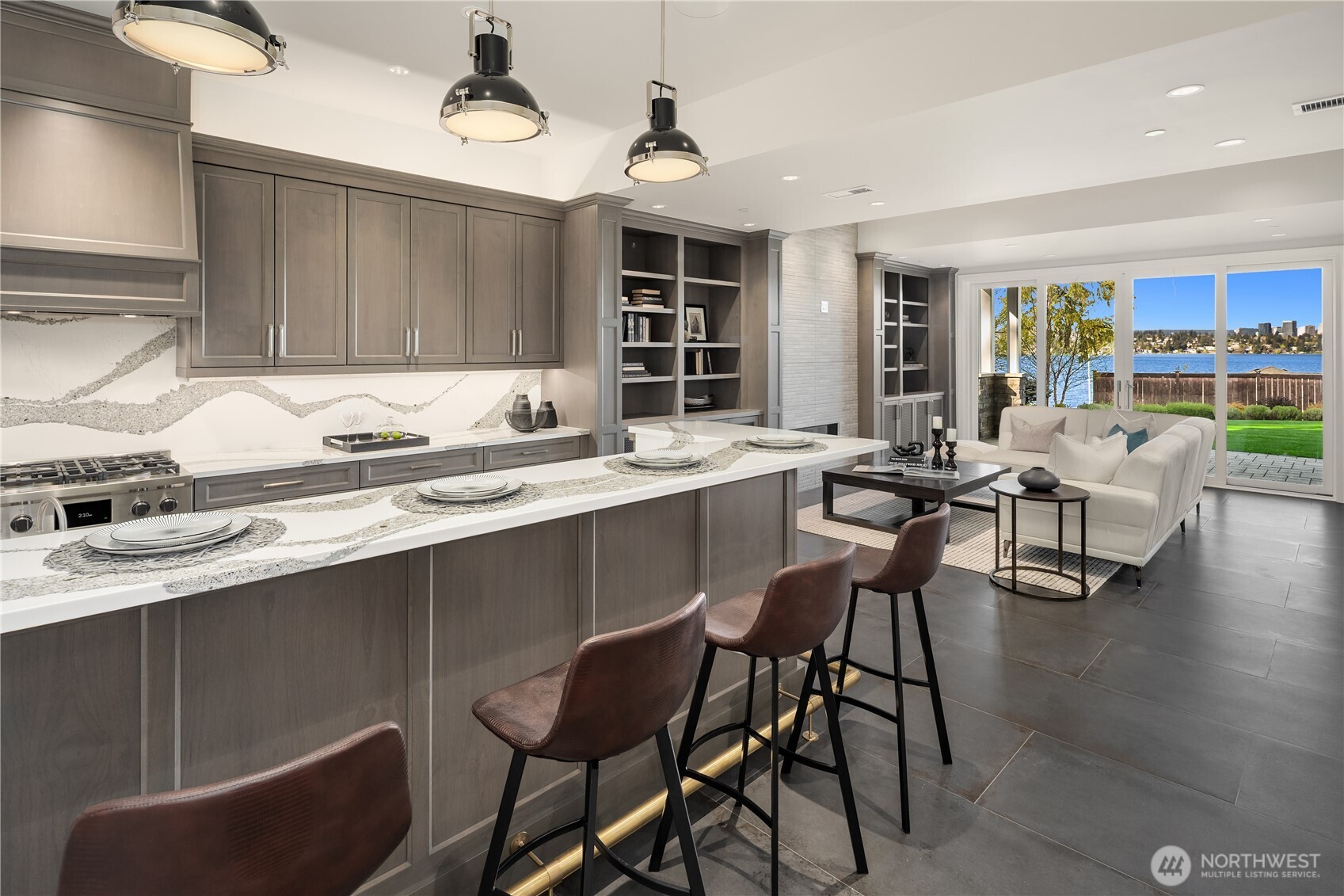 7254 North Mercer Way Mercer Island, WA 98040 - Photo 27 of 37 a kitchen with a dining table chairs and white cabinets