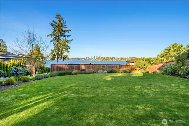 a view of a garden with a building in the background