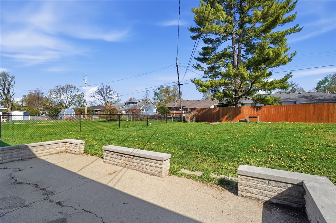 1325 Chelsea Road Troy, OH 45373 - Photo 41 of 42 This spacious yard offers a vibrant green lawn and durable fencing, perfect for outdoor enjoyment.