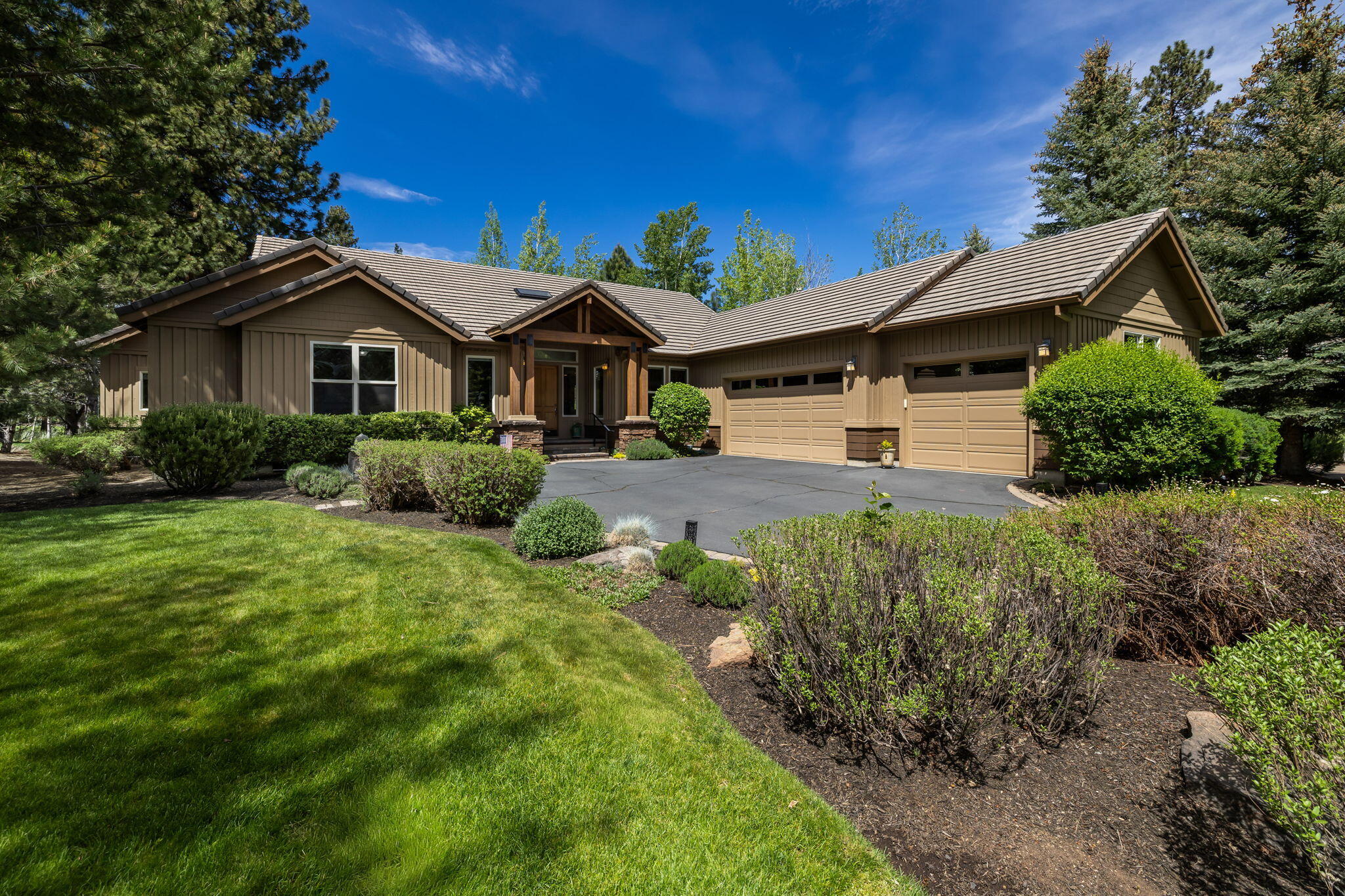 19574 Green Lakes Loop Bend, OR 97702 - Photo 1 of 41 Set on a beautifully landscaped .42-acre homesite, this single-level Broken Top residence offers privacy, mature landscaping, and a peaceful 17th fairway setting.