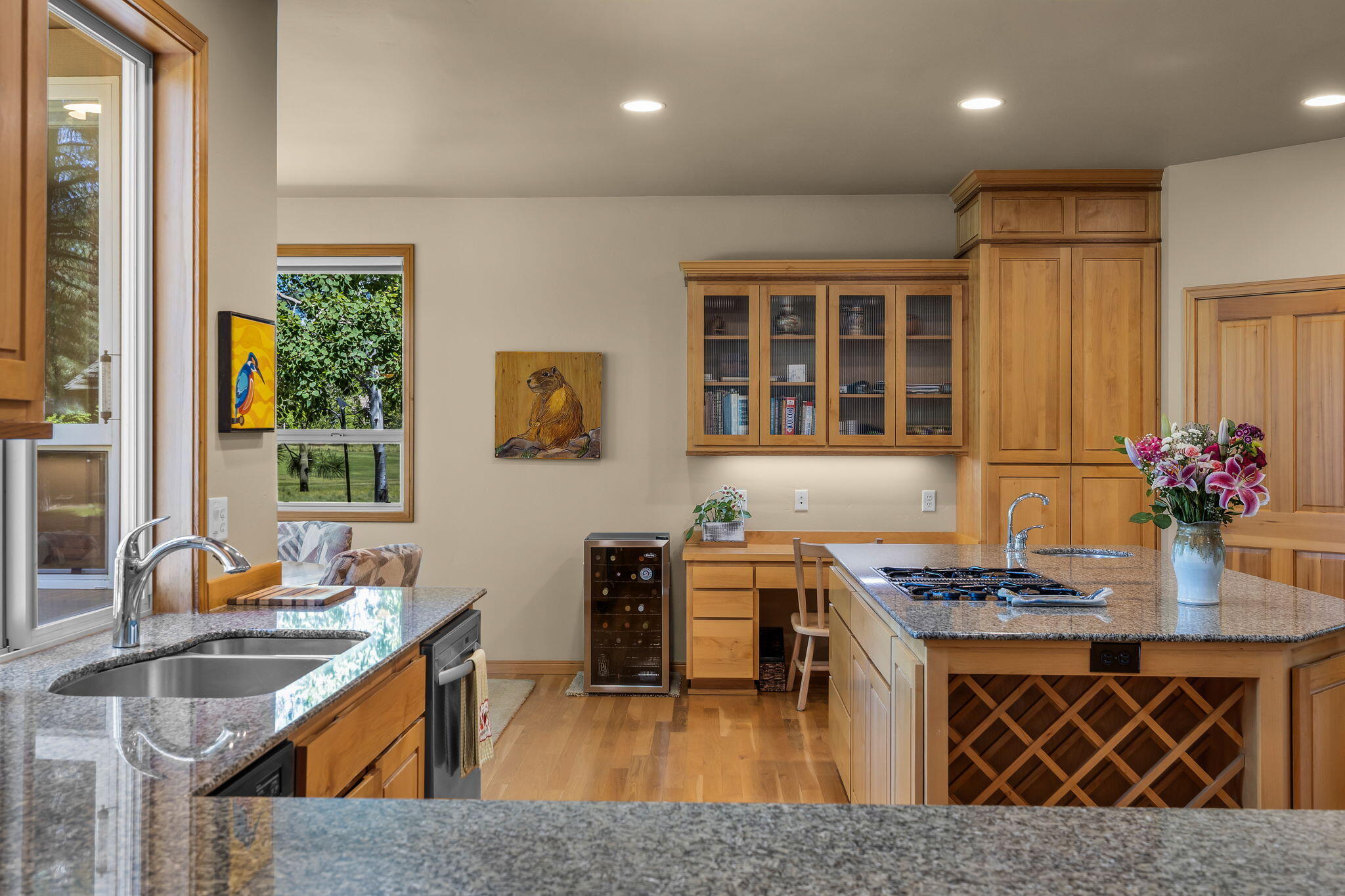 19574 Green Lakes Loop Bend, OR 97702 - Photo 12 of 41 The kitchen offers generous cabinetry, granite counters, hardwood floors, and multiple work areas designed for everyday function.