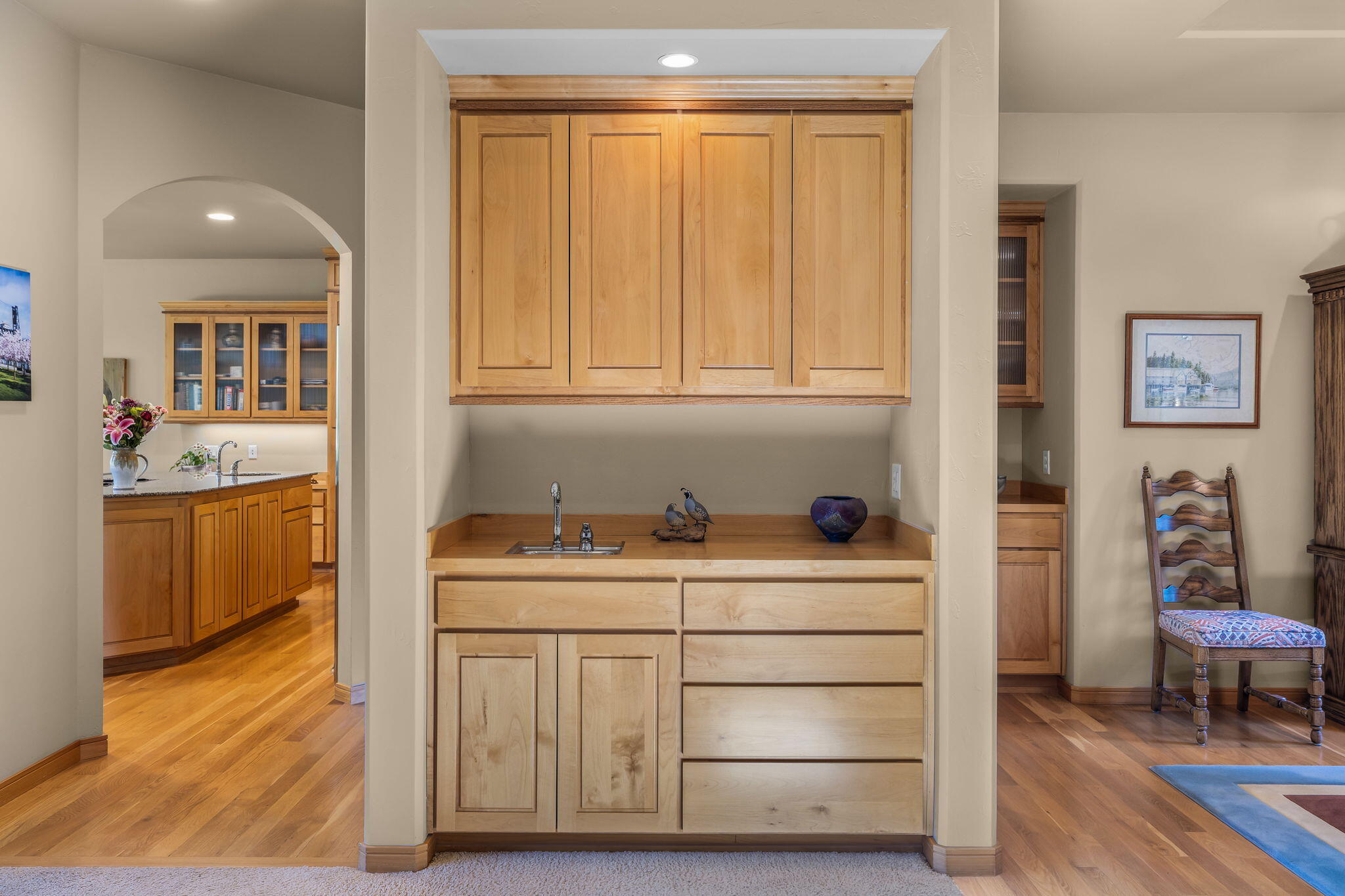 19574 Green Lakes Loop Bend, OR 97702 - Photo 15 of 41 A built-in buffet with sink and cabinetry adds useful serving and storage space between the kitchen and dining areas.
