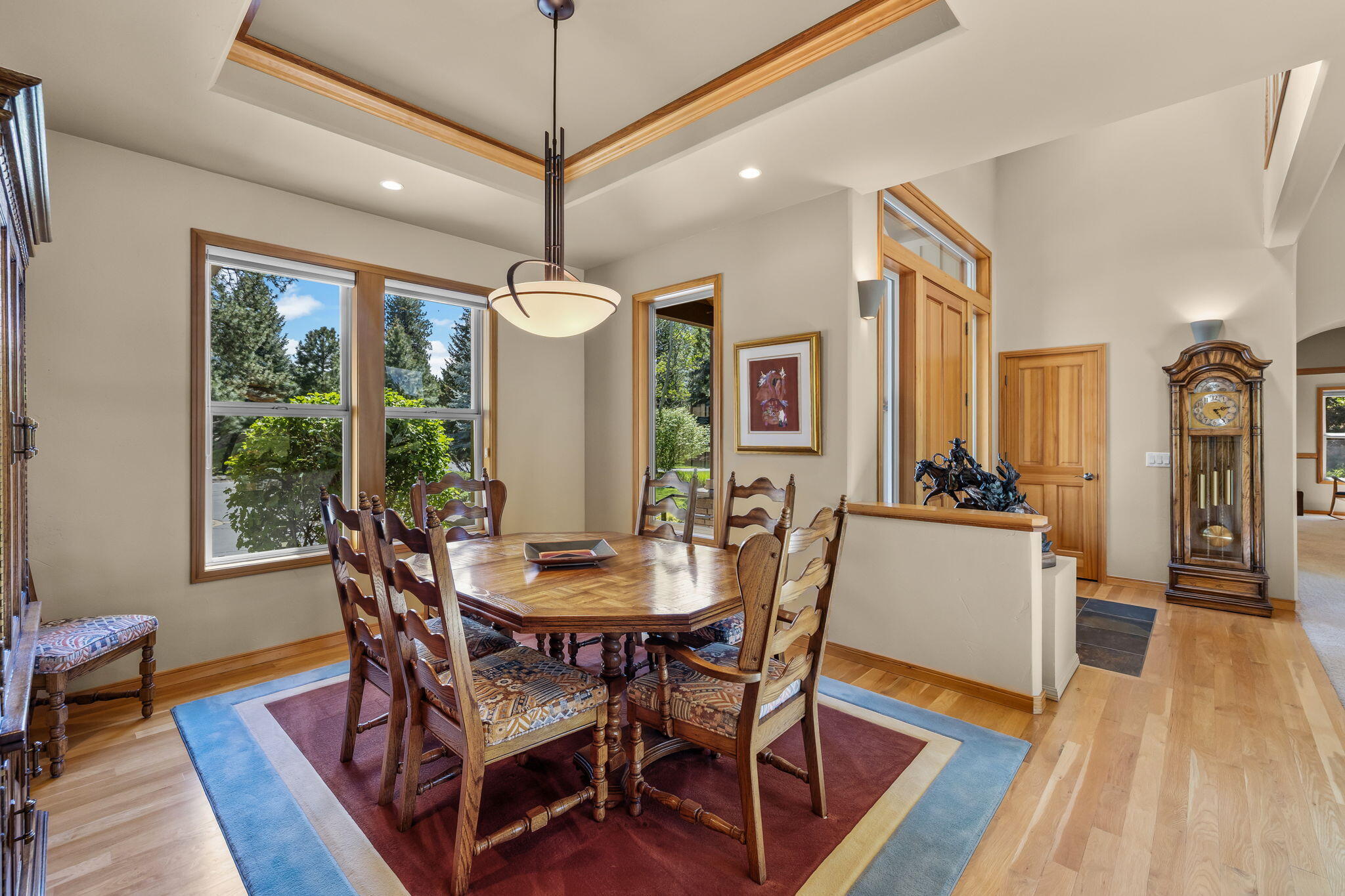 19574 Green Lakes Loop Bend, OR 97702 - Photo 18 of 41 The dining room is conveniently positioned near the entry and kitchen, offering a comfortable setting for gatherings while maintaining an easy single-level flow.