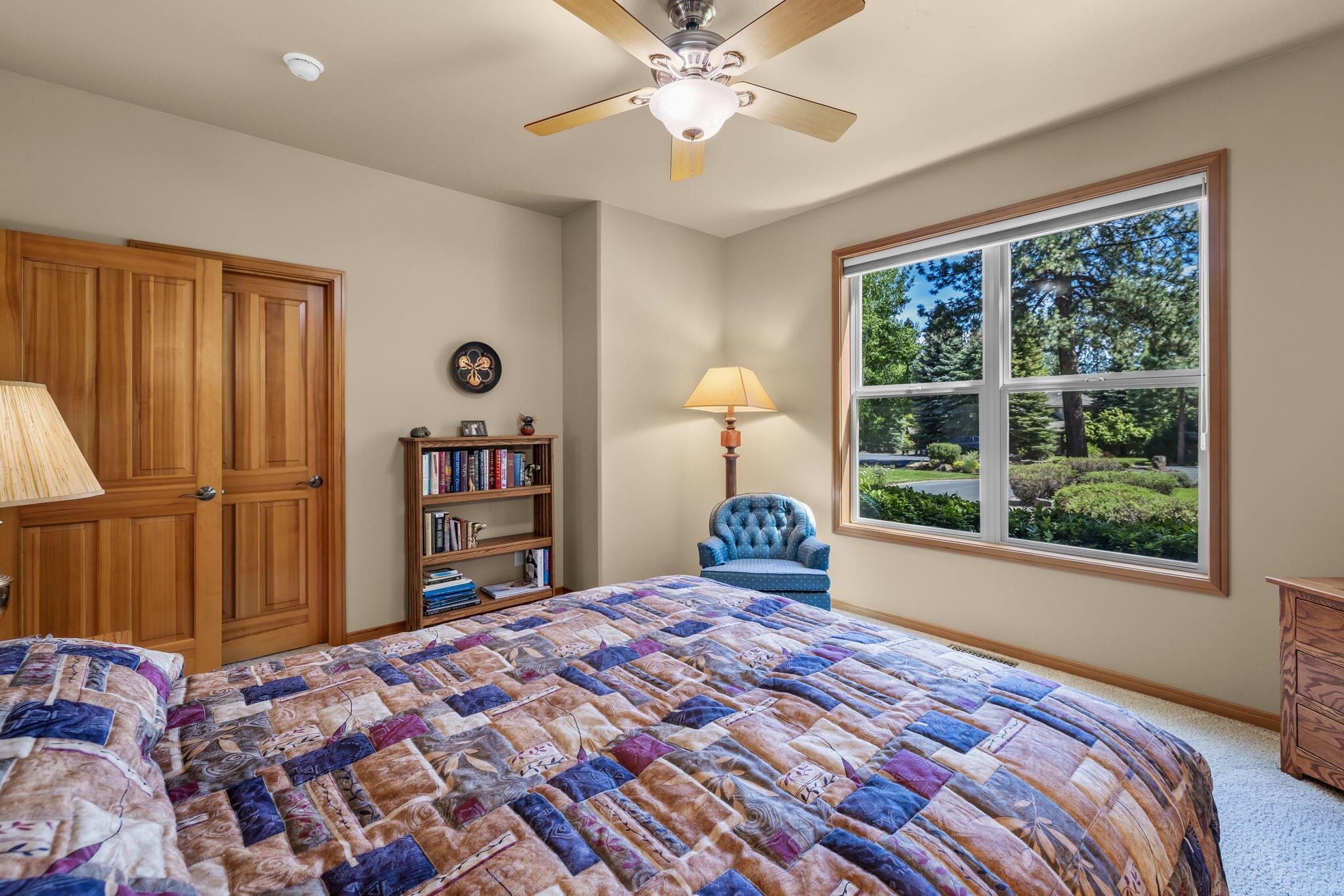 19574 Green Lakes Loop Bend, OR 97702 - Photo 26 of 41 A comfortable guest bedroom with generous natural light, large windows, and easy access to a full bath.