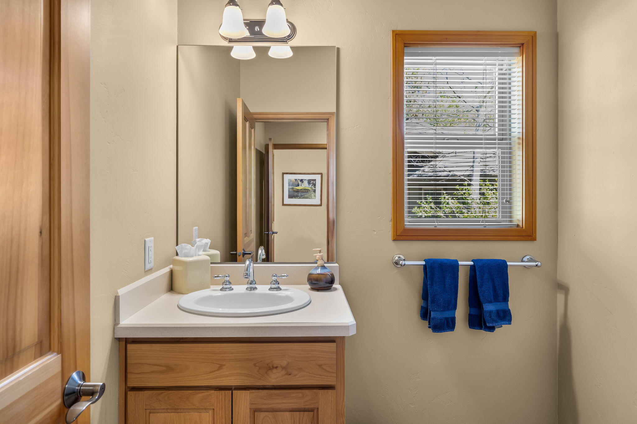 19574 Green Lakes Loop Bend, OR 97702 - Photo 31 of 41 Easily accessed second powder room, located near the laundry room and 3-car garage.