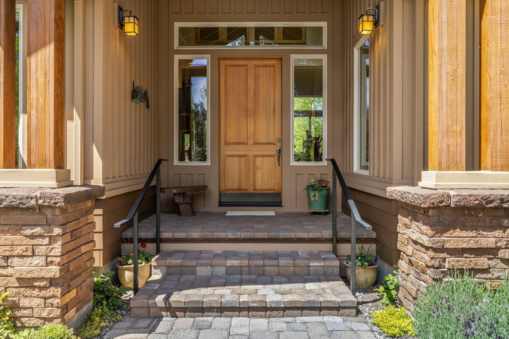 19574 Green Lakes Loop Bend, OR 97702 - Photo 4 of 41 Covered front entry with timber accents, stone detailing, and a warm, inviting sense of arrival.
