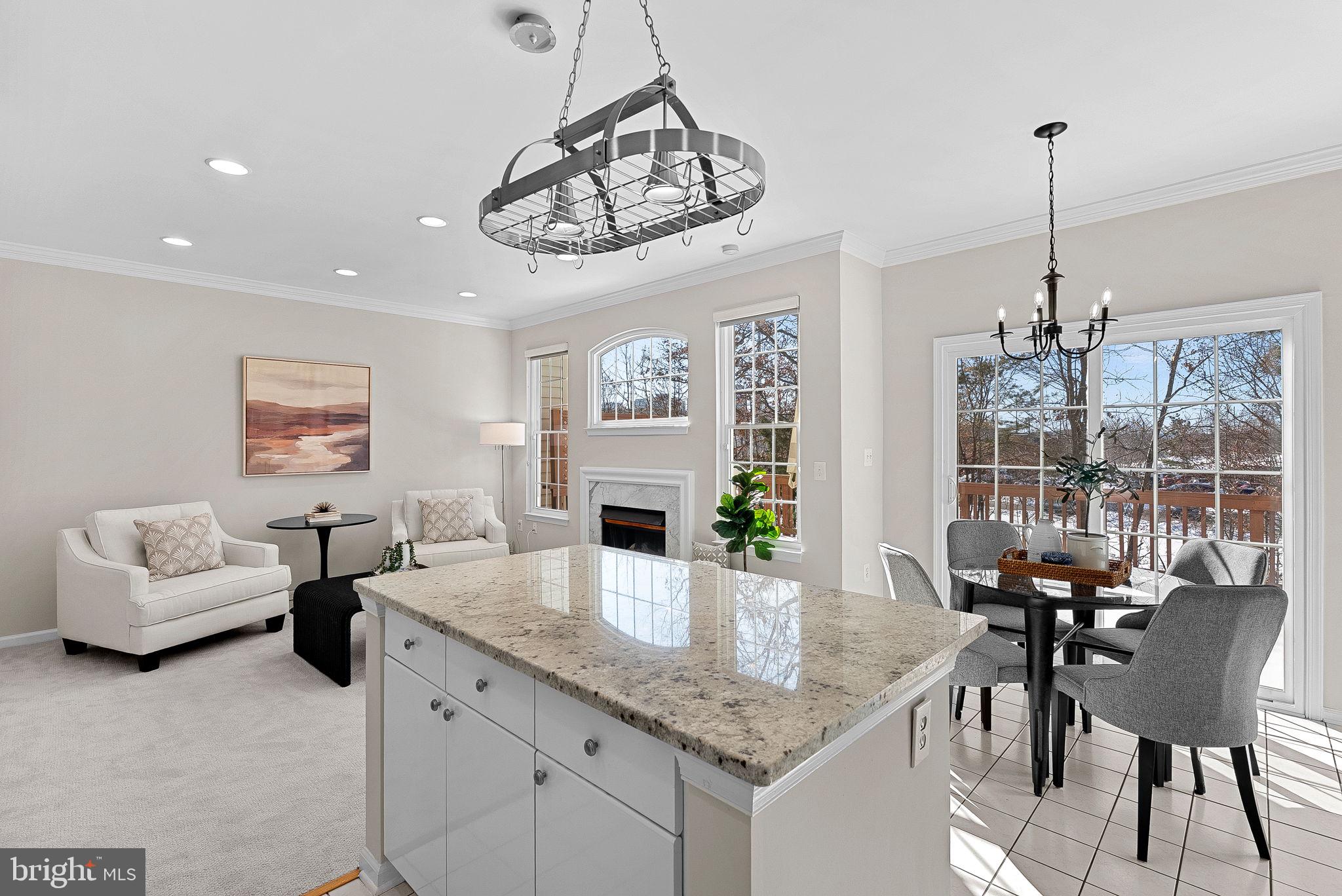 1733 Stuart Pointe Lane Herndon, VA 20194 - Photo 14 of 49 a view of a dining room and livingroom with furniture wooden floor a chandelier