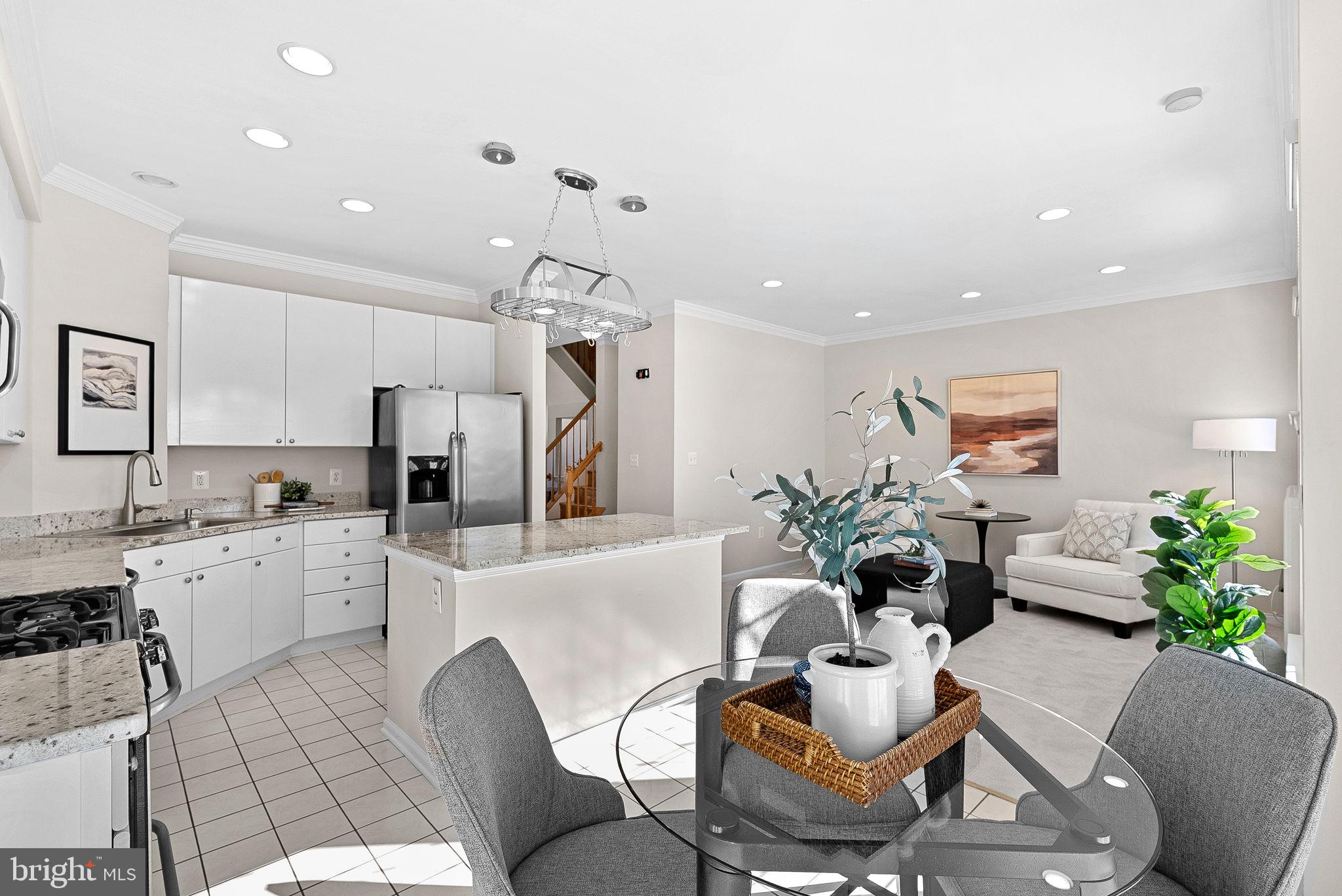 1733 Stuart Pointe Lane Herndon, VA 20194 - Photo 16 of 49 a living room with furniture kitchen and a chandelier