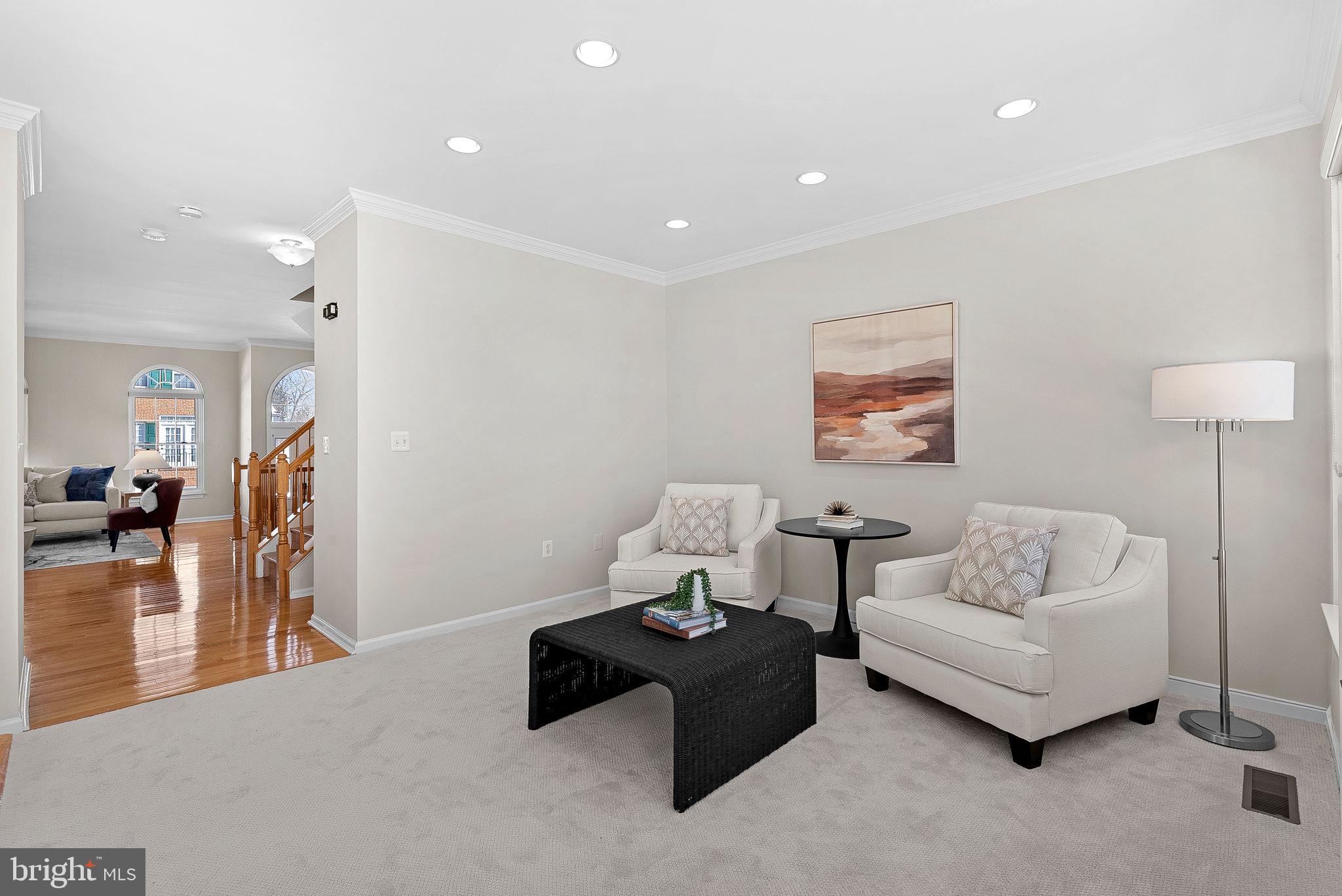 1733 Stuart Pointe Lane Herndon, VA 20194 - Photo 19 of 49 a living room with furniture and a couch