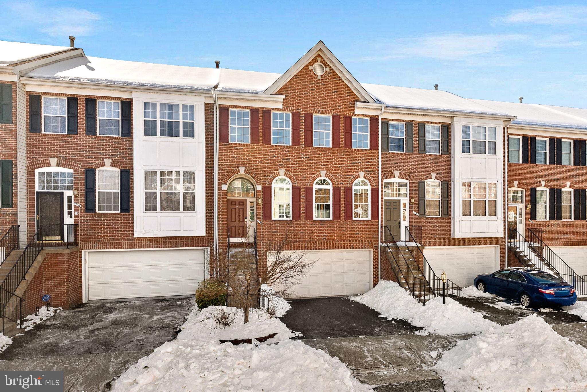 1733 Stuart Pointe Lane Herndon, VA 20194 - Photo 2 of 49 a front view of a house with a yard