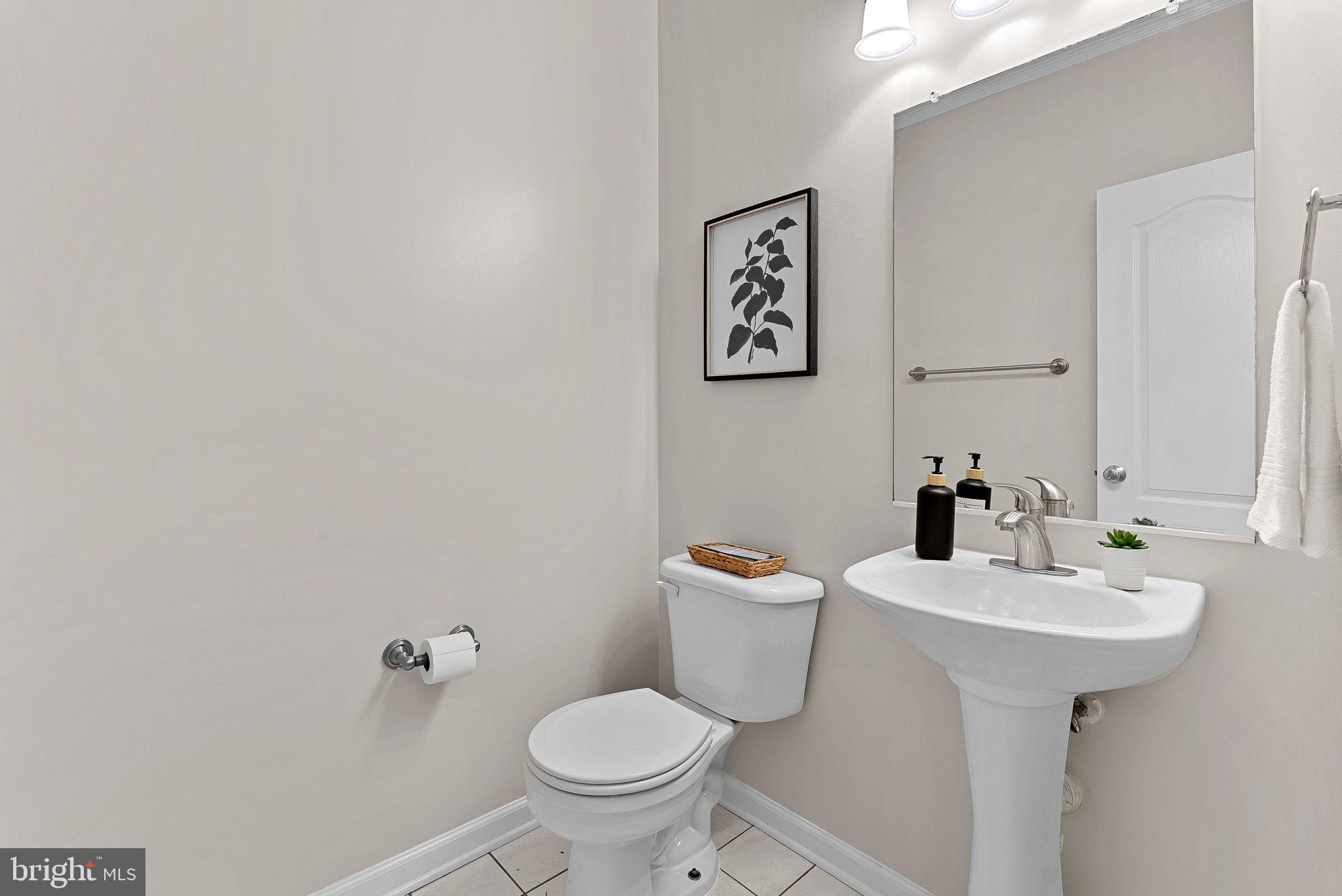 1733 Stuart Pointe Lane Herndon, VA 20194 - Photo 22 of 49 a bathroom with a sink toilet and a mirror