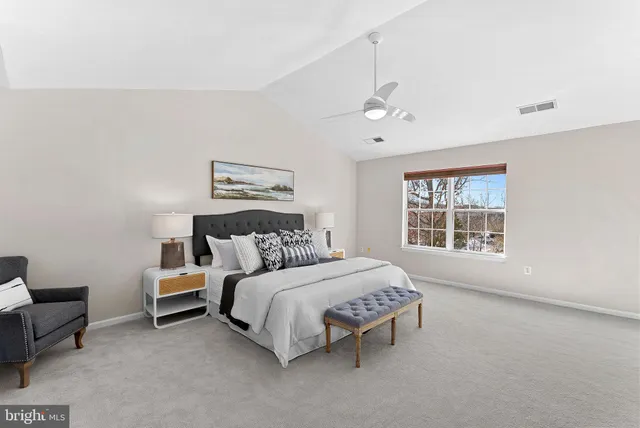 a bed room with a bed and a night stand