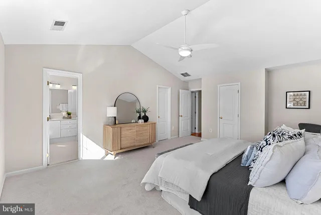a bathroom with a double vanity sink mirror and shower