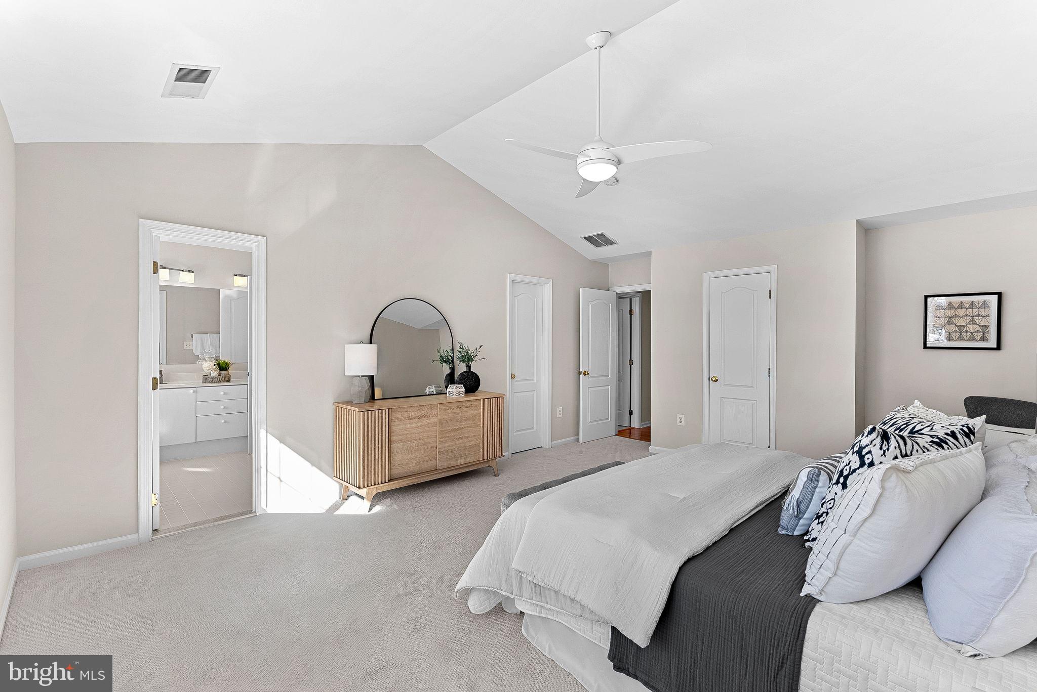 1733 Stuart Pointe Lane Herndon, VA 20194 - Photo 27 of 49 a bedroom with a bed and a chandelier