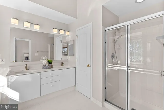 a bathroom with a sink a vanity and a mirror