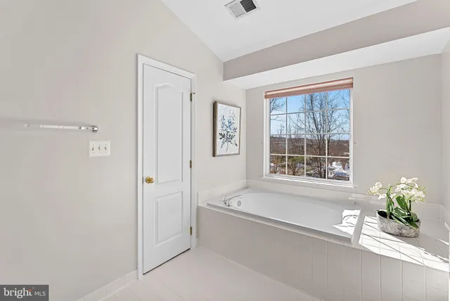 a view of bedroom with wooden floor