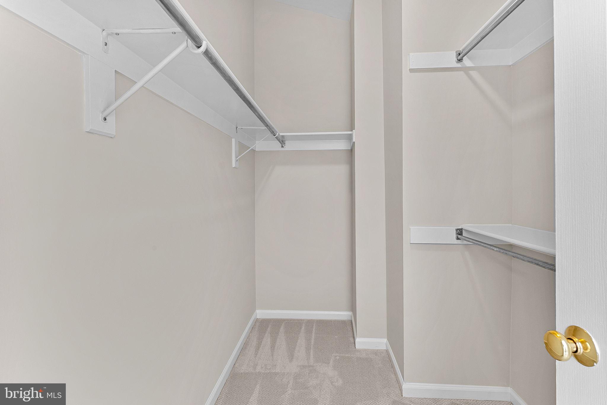 1733 Stuart Pointe Lane Herndon, VA 20194 - Photo 32 of 49 a view of an empty walk in closet