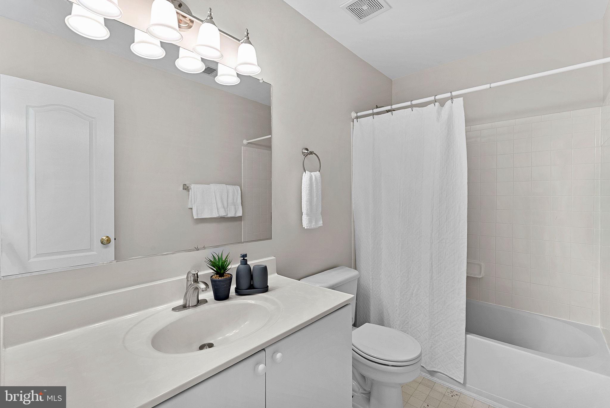 1733 Stuart Pointe Lane Herndon, VA 20194 - Photo 34 of 49 a bathroom with a sink a toilet and a mirror