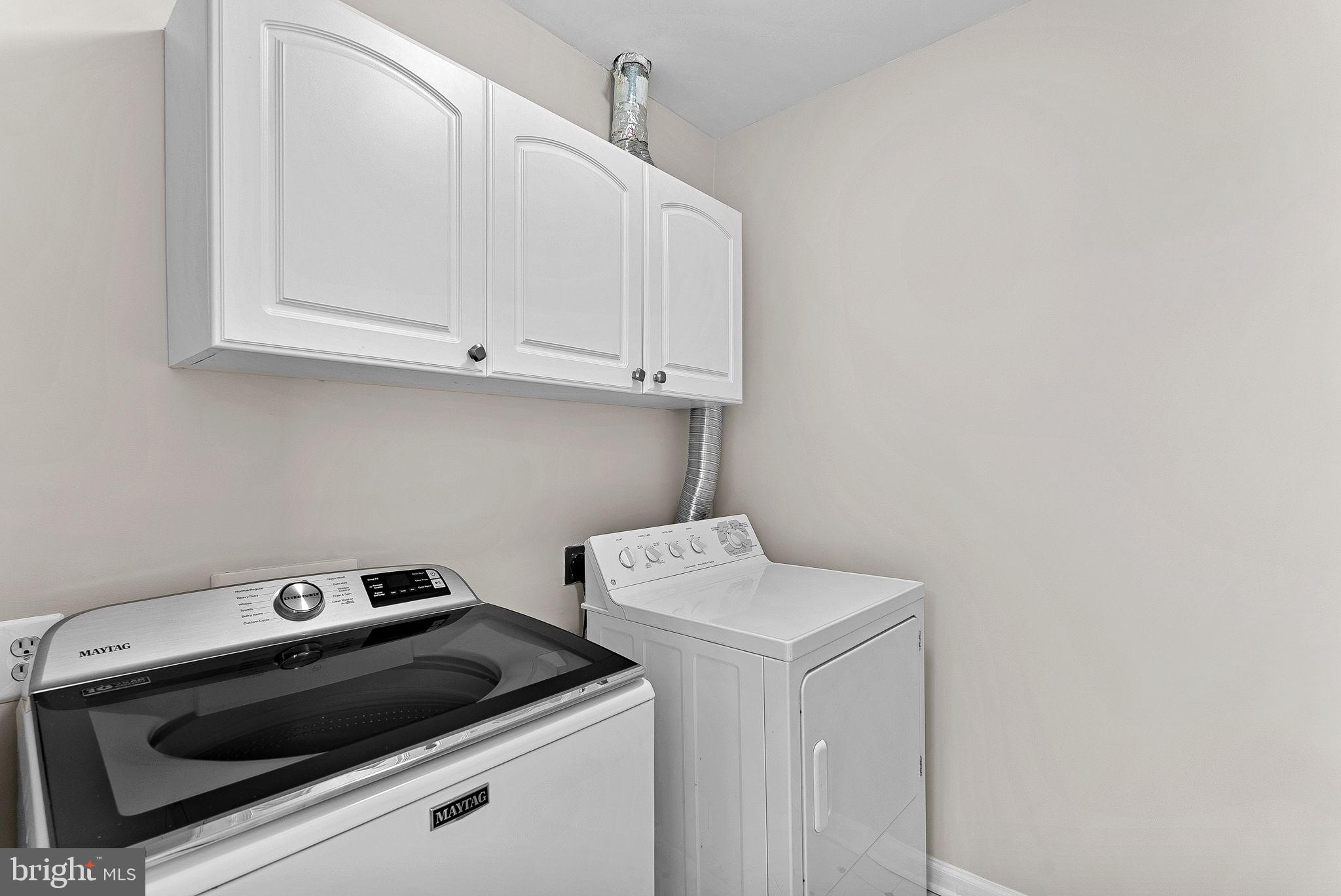 1733 Stuart Pointe Lane Herndon, VA 20194 - Photo 35 of 49 a utility room with dryer and washer