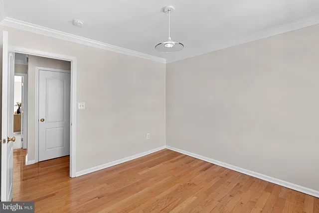 a view of room and window and a ceiling fan