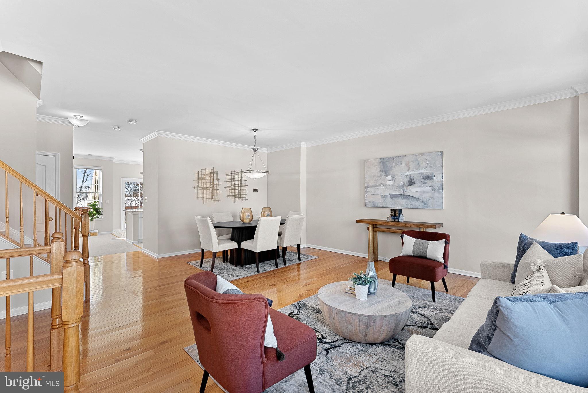 1733 Stuart Pointe Lane Herndon, VA 20194 - Photo 4 of 49 a living room with furniture and a wooden floor
