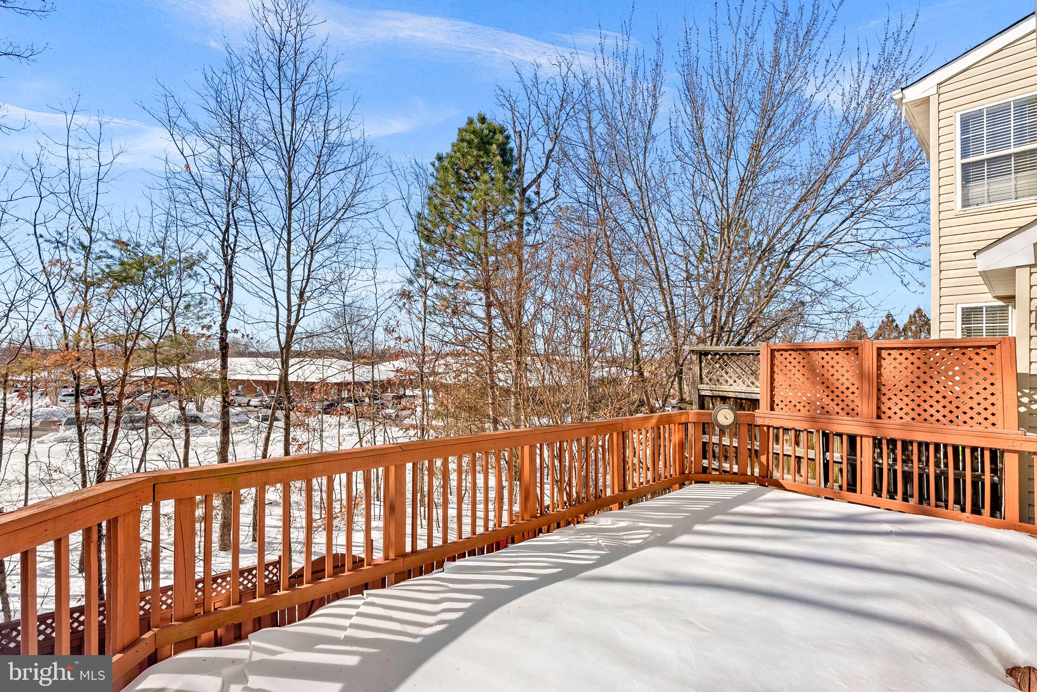 1733 Stuart Pointe Lane Herndon, VA 20194 - Photo 43 of 49 a view of a wooden fence and trees