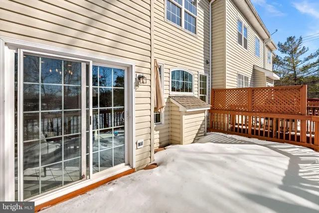 a view of backyard with wooden fence