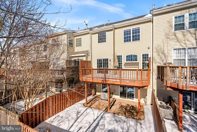 a view of a building with a bench in patio