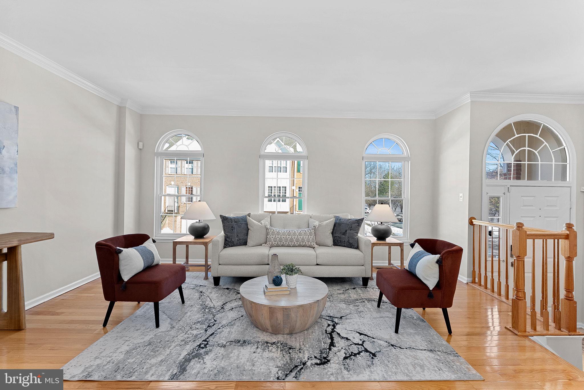1733 Stuart Pointe Lane Herndon, VA 20194 - Photo 6 of 49 a living room with furniture and a large window