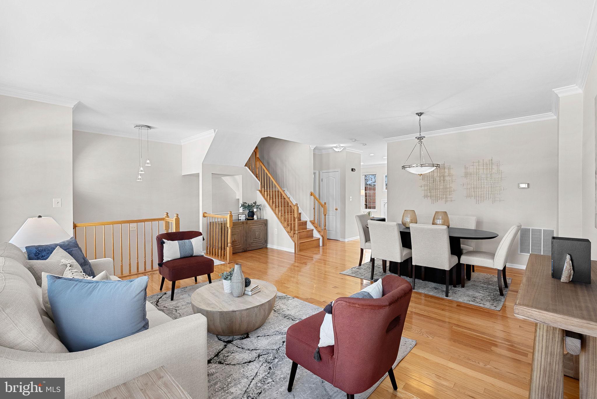 1733 Stuart Pointe Lane Herndon, VA 20194 - Photo 7 of 49 a living room with furniture and wooden floor