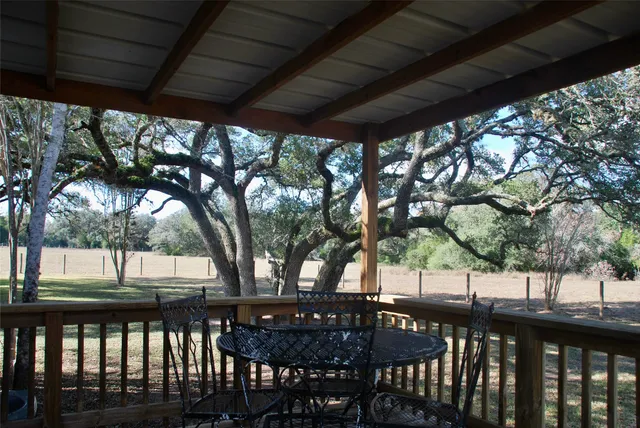 a view of a chairs and table in the yard