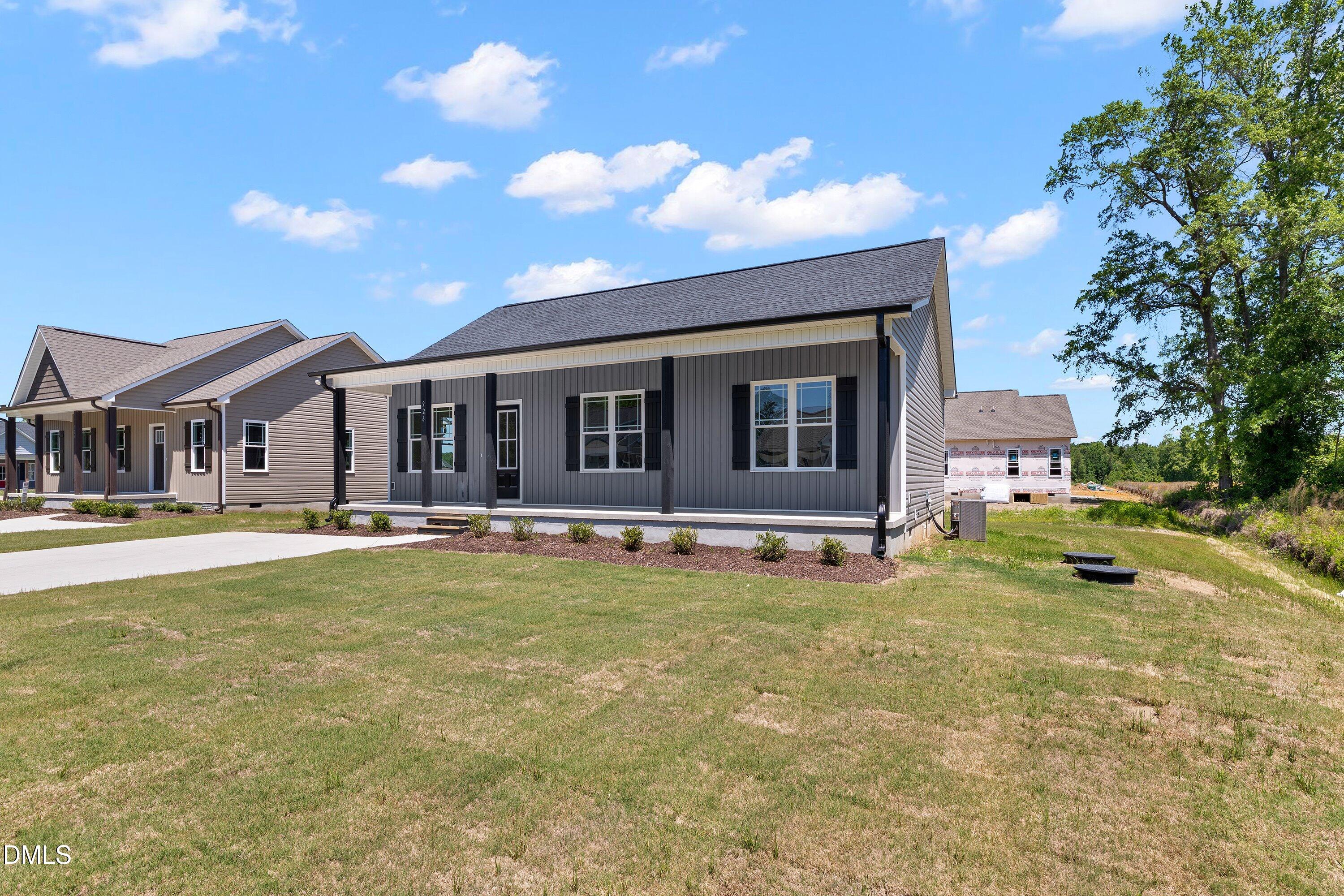 926 Micro Road West Selma, NC 27576 - Photo 3 of 41 a view of a house with swimming pool and sitting area